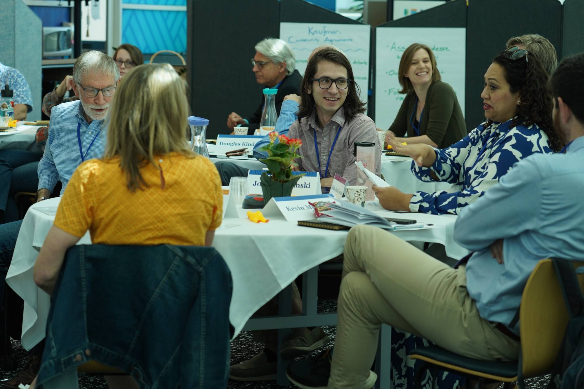 Photo of table discussions between conference attendees